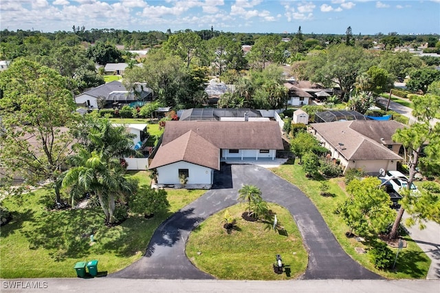 208 Erie Dr, Naples, FL 34110 - aerial perspective of suburban area with a tree filled landscape