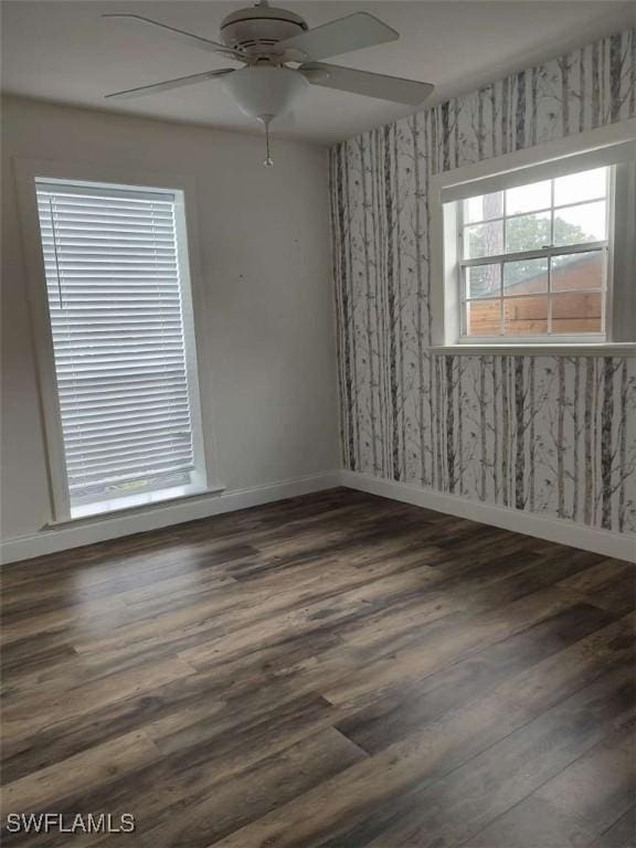 7821 Deni Dr, North Fort Myers, FL 33917 - empty room featuring ceiling fan, baseboards, wood finished floors, and wallpapered walls