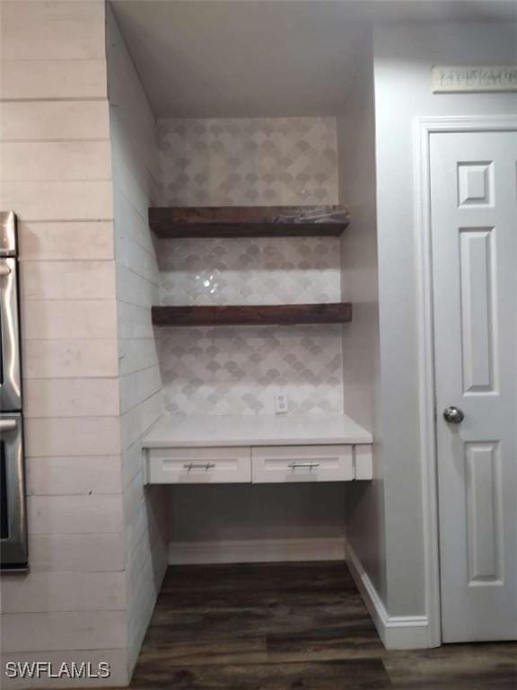 7821 Deni Dr, North Fort Myers, FL 33917 - detailed view of dark wood finished floors, light countertops, and white cabinets