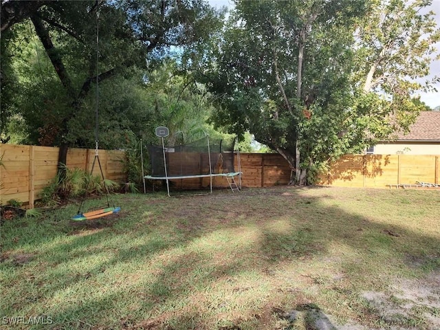 7821 Deni Dr, North Fort Myers, FL 33917 - view of yard with a trampoline