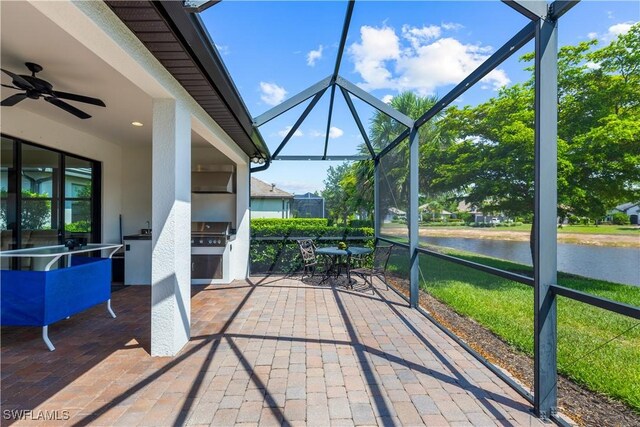 7445 Winding Cypress Dr, Naples, FL 34114 - sunroom / solarium featuring area for grilling, a ceiling fan, a water view, and outdoor dining area