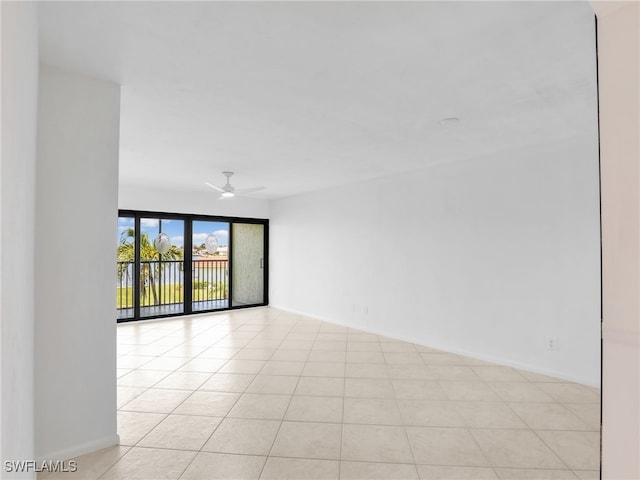 750 W Elkcam Cir Unit 312, Marco Island, FL 34145 - unfurnished room with ceiling fan and light tile patterned floors