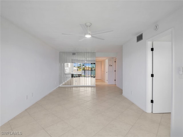 750 W Elkcam Cir Unit 312, Marco Island, FL 34145 - spare room featuring a ceiling fan and a smoke detector