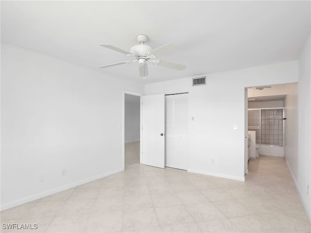 750 W Elkcam Cir Unit 312, Marco Island, FL 34145 - unfurnished bedroom featuring a closet and a ceiling fan