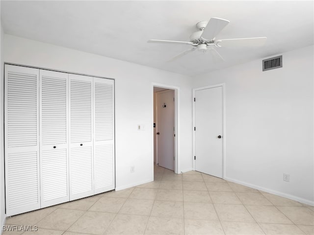 750 W Elkcam Cir Unit 312, Marco Island, FL 34145 - unfurnished bedroom with a closet and a ceiling fan
