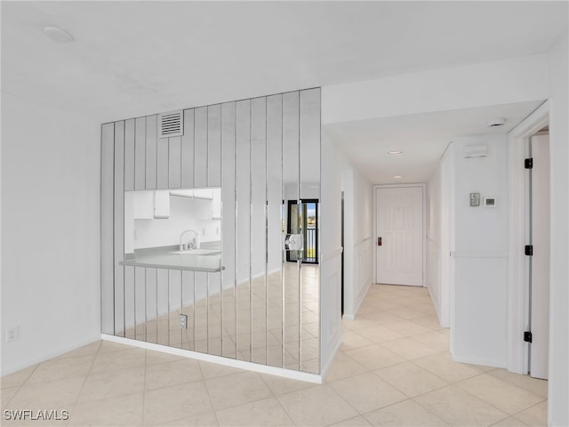 750 W Elkcam Cir Unit 312, Marco Island, FL 34145 - hall featuring a sink and light tile patterned floors
