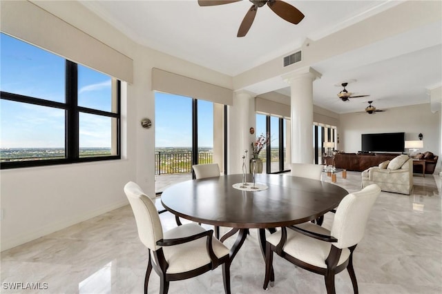 14300 Riva Del Lago Dr Unit 2103, Fort Myers, FL 33907 - dining area featuring ceiling fan, ornamental molding, ornate columns, baseboards, and light marble finish floors
