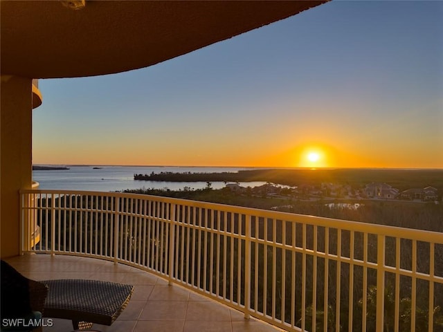 6081 Silver King Blvd Unit 704, Cape Coral, FL 33914 - balcony at dusk with a water view