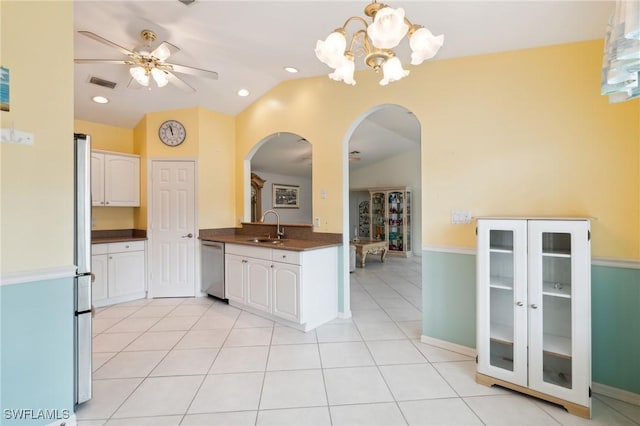877 Charlemagne Blvd, Naples, FL 34112 - kitchen featuring arched walkways, a sink, dark countertops, dishwasher, and lofted ceiling