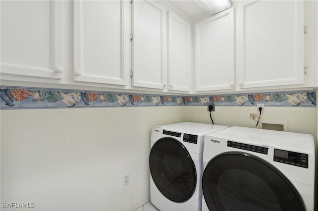 877 Charlemagne Blvd, Naples, FL 34112 - laundry area with cabinet space and washing machine and clothes dryer
