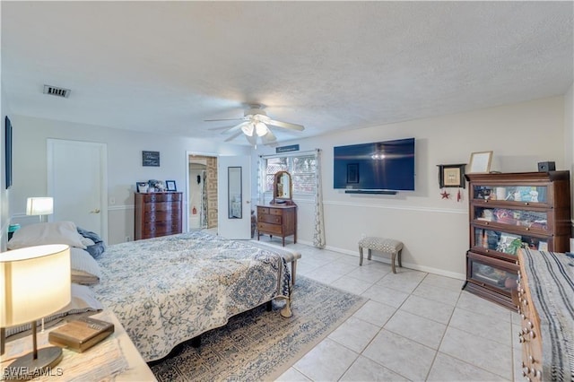 204 Flagler St, Clewiston, FL 33440 - bedroom with light tile patterned floors, ceiling fan, baseboards, and a textured ceiling