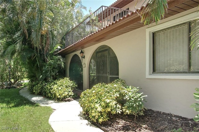 27910 Hacienda E Blvd Unit 201B, Bonita Springs, FL 34135 - view of home's exterior with stucco siding and a balcony