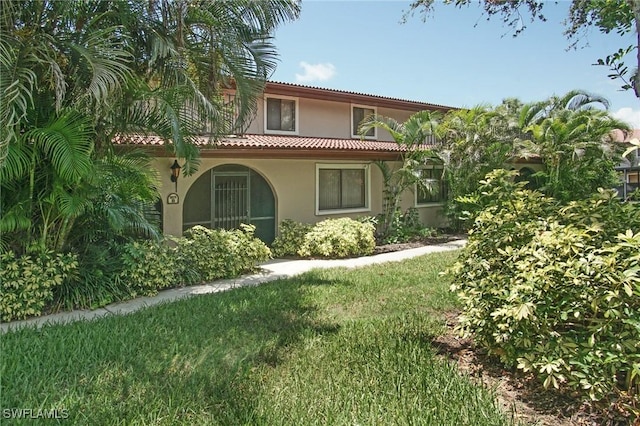 27910 Hacienda E Blvd Unit 201B, Bonita Springs, FL 34135 - mediterranean / spanish home with a tile roof and stucco siding