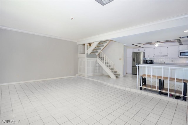 27910 Hacienda E Blvd Unit 201B, Bonita Springs, FL 34135 - unfurnished living room with stairs, ornamental molding, baseboards, and ceiling fan