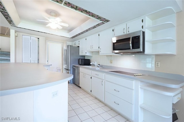 27910 Hacienda E Blvd Unit 201B, Bonita Springs, FL 34135 - kitchen featuring black appliances, open shelves, and light countertops