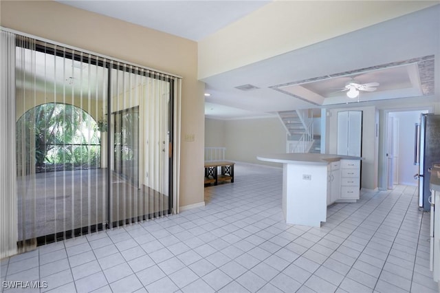 27910 Hacienda E Blvd Unit 201B, Bonita Springs, FL 34135 - kitchen with freestanding refrigerator, ceiling fan, open floor plan, a tray ceiling, and light countertops