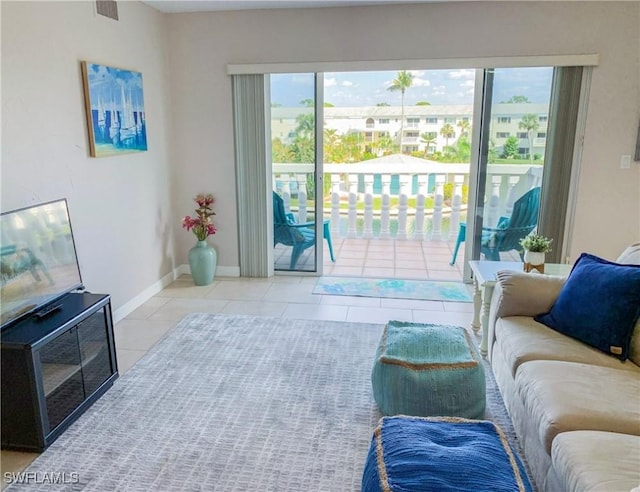 13511 Stratford Place Cir Unit 305, Fort Myers, FL 33919 - tiled living area with baseboards