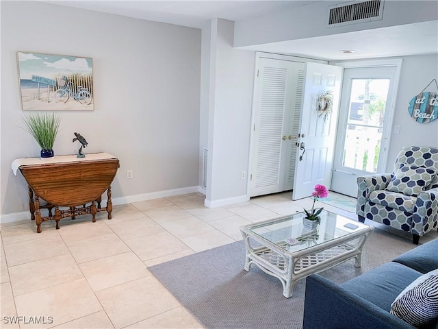 13511 Stratford Place Cir Unit 305, Fort Myers, FL 33919 - living room with baseboards and light tile patterned floors