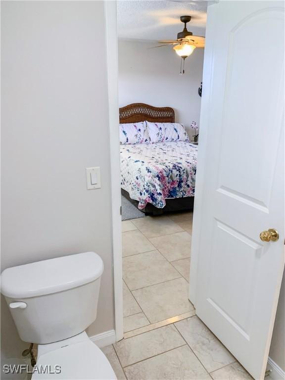 13511 Stratford Place Cir Unit 305, Fort Myers, FL 33919 - ensuite bathroom with ceiling fan, toilet, and baseboards