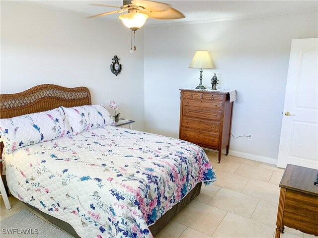13511 Stratford Place Cir Unit 305, Fort Myers, FL 33919 - bedroom featuring light tile patterned flooring, baseboards, a ceiling fan, and ornamental molding