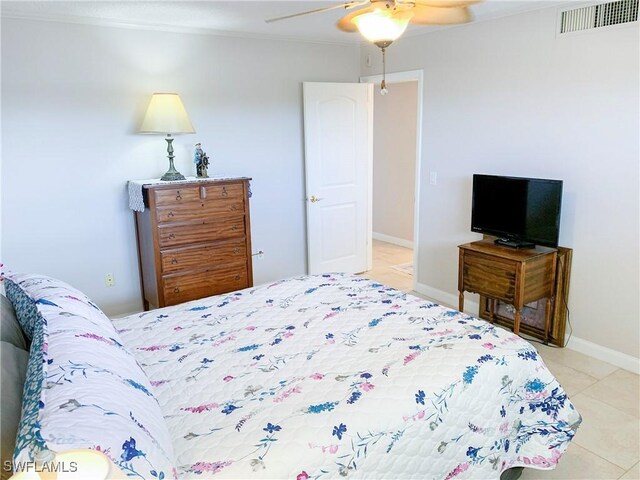 13511 Stratford Place Cir Unit 305, Fort Myers, FL 33919 - bedroom featuring light tile patterned floors, a ceiling fan, and baseboards