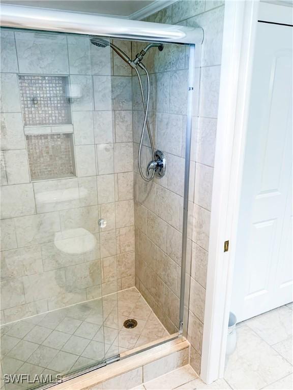 13511 Stratford Place Cir Unit 305, Fort Myers, FL 33919 - full bathroom with a shower stall