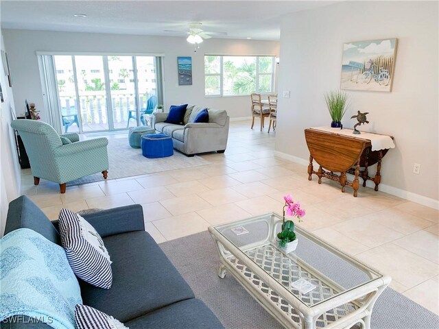 13511 Stratford Place Cir Unit 305, Fort Myers, FL 33919 - living room with a ceiling fan, baseboards, and tile patterned floors