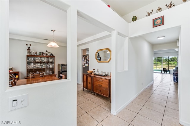4665 47th Ave NE, Naples, FL 34120 - corridor with light tile patterned flooring and baseboards