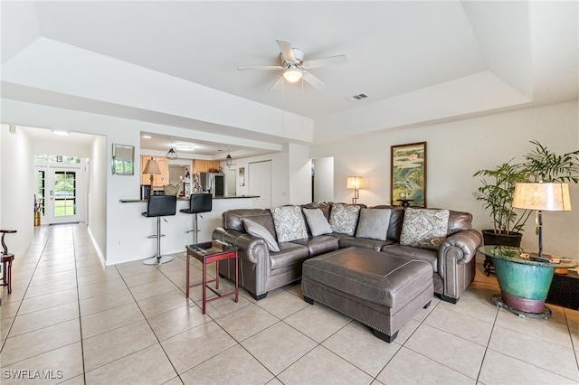 4665 47th Ave NE, Naples, FL 34120 - living area featuring ceiling fan, light tile patterned floors, and a tray ceiling
