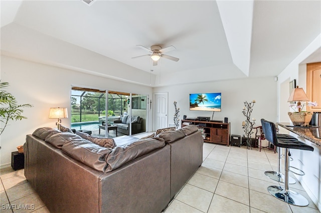 4665 47th Ave NE, Naples, FL 34120 - living room with ceiling fan, light tile patterned floors, and a raised ceiling