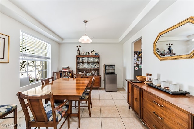 4665 47th Ave NE, Naples, FL 34120 - dining space with a raised ceiling, light tile patterned floors, and baseboards