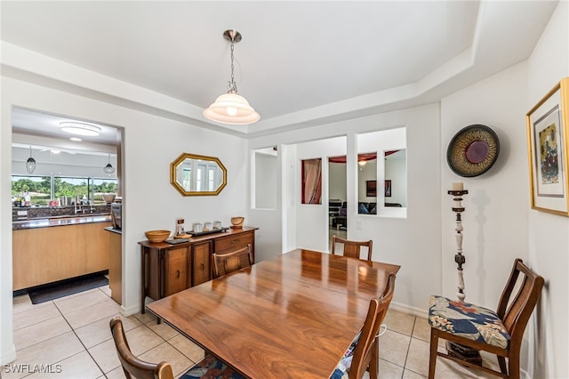 4665 47th Ave NE, Naples, FL 34120 - dining space featuring light tile patterned floors and a tray ceiling