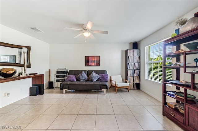 4665 47th Ave NE, Naples, FL 34120 - living room with a ceiling fan, light tile patterned floors, and baseboards