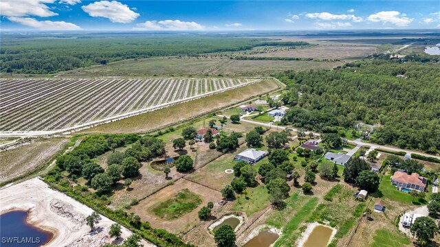 4665 47th Ave NE, Naples, FL 34120 - aerial view of property and surrounding area featuring rural landscape and a heavily wooded area
