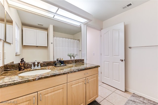 4665 47th Ave NE, Naples, FL 34120 - full bath with vanity, tile patterned flooring, and baseboards