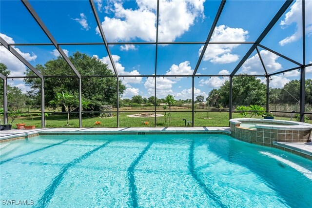4665 47th Ave NE, Naples, FL 34120 - view of swimming pool featuring glass enclosure and a pool with connected hot tub