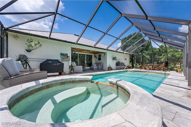 4665 47th Ave NE, Naples, FL 34120 - view of pool featuring a pool with connected hot tub, a patio, an outdoor living space, a grill, and glass enclosure