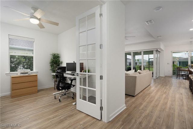 42530 Atlas Dr, Punta Gorda, FL 33982 - home office featuring ceiling fan, light wood-type flooring, and baseboards