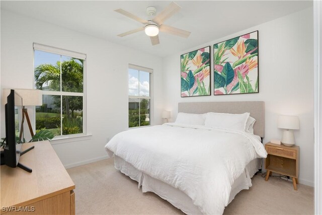 42530 Atlas Dr, Punta Gorda, FL 33982 - bedroom with light carpet, multiple windows, and baseboards