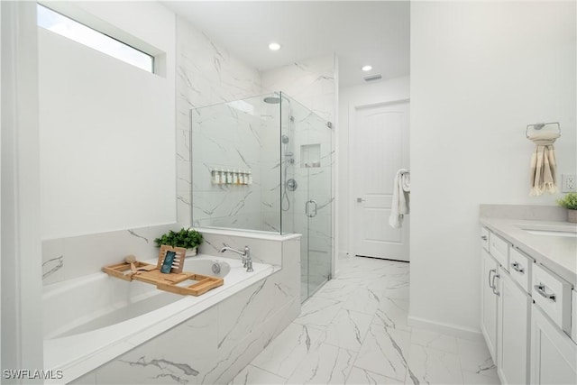 42530 Atlas Dr, Punta Gorda, FL 33982 - full bathroom featuring marble look tile flooring, a garden tub, a marble finish shower, vanity, and baseboards