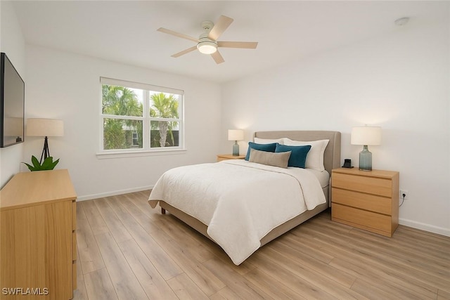 42530 Atlas Dr, Punta Gorda, FL 33982 - bedroom with baseboards, light wood-type flooring, and ceiling fan