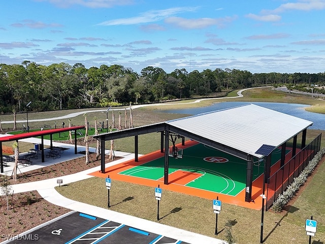 42530 Atlas Dr, Punta Gorda, FL 33982 - view of community with uncovered parking, view of wooded area, and a water view