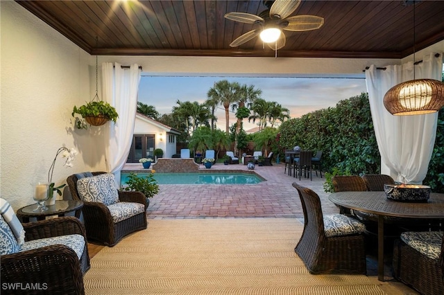 10340 Vanderbilt Dr, Naples, FL 34108 - outdoor pool featuring a patio, ceiling fan, and outdoor dining space