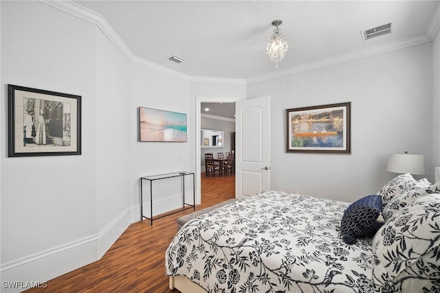 10340 Vanderbilt Dr, Naples, FL 34108 - bedroom featuring ornamental molding, dark wood-type flooring, a chandelier, and baseboards