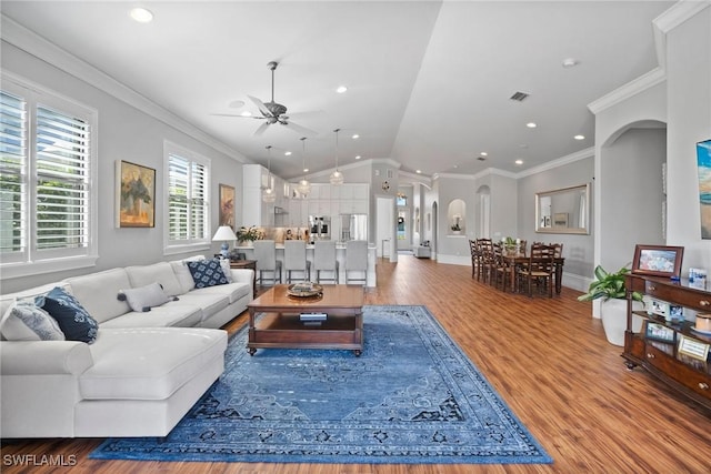 10340 Vanderbilt Dr, Naples, FL 34108 - living area featuring ceiling fan, wood finished floors, lofted ceiling, ornamental molding, and baseboards