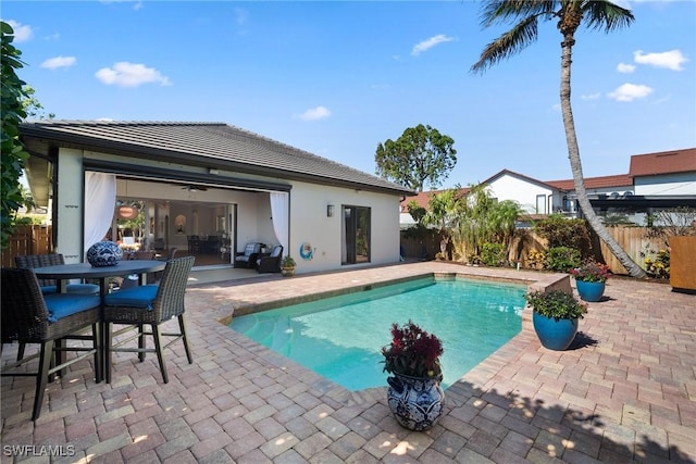 10340 Vanderbilt Dr, Naples, FL 34108 - view of swimming pool featuring a patio area and a fenced backyard