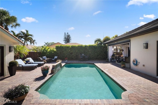 10340 Vanderbilt Dr, Naples, FL 34108 - view of swimming pool featuring a patio, a fenced backyard, and grilling area