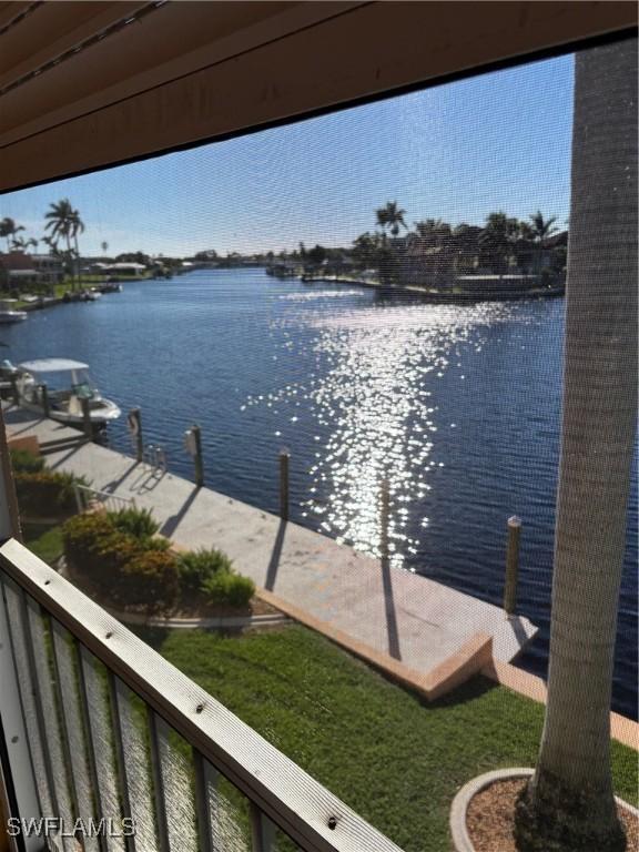 4210 SE 19th Ave Unit 2J, Cape Coral, FL 33904 - dock area with a water view and a balcony