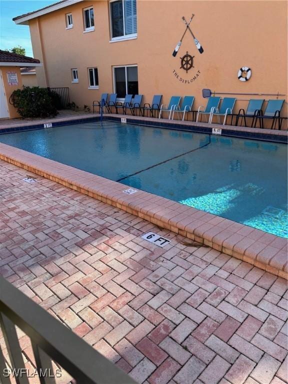 4210 SE 19th Ave Unit 2J, Cape Coral, FL 33904 - community pool featuring a patio area