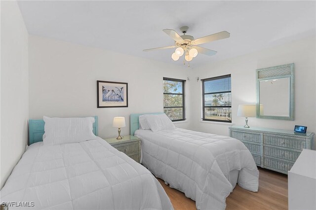 3627 Clipper Ln, Saint James City, FL 33956 - bedroom featuring light wood-type flooring and a ceiling fan